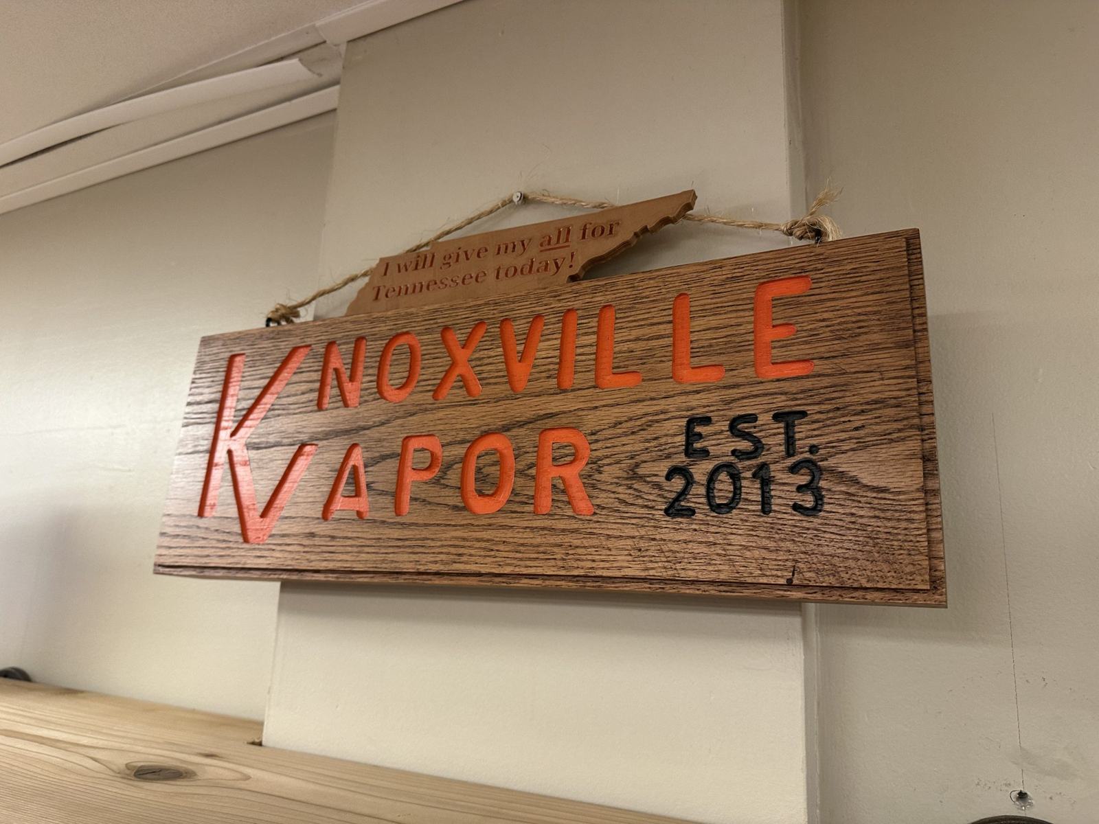 Carved oak Knoxville Vapor sign, established 2013