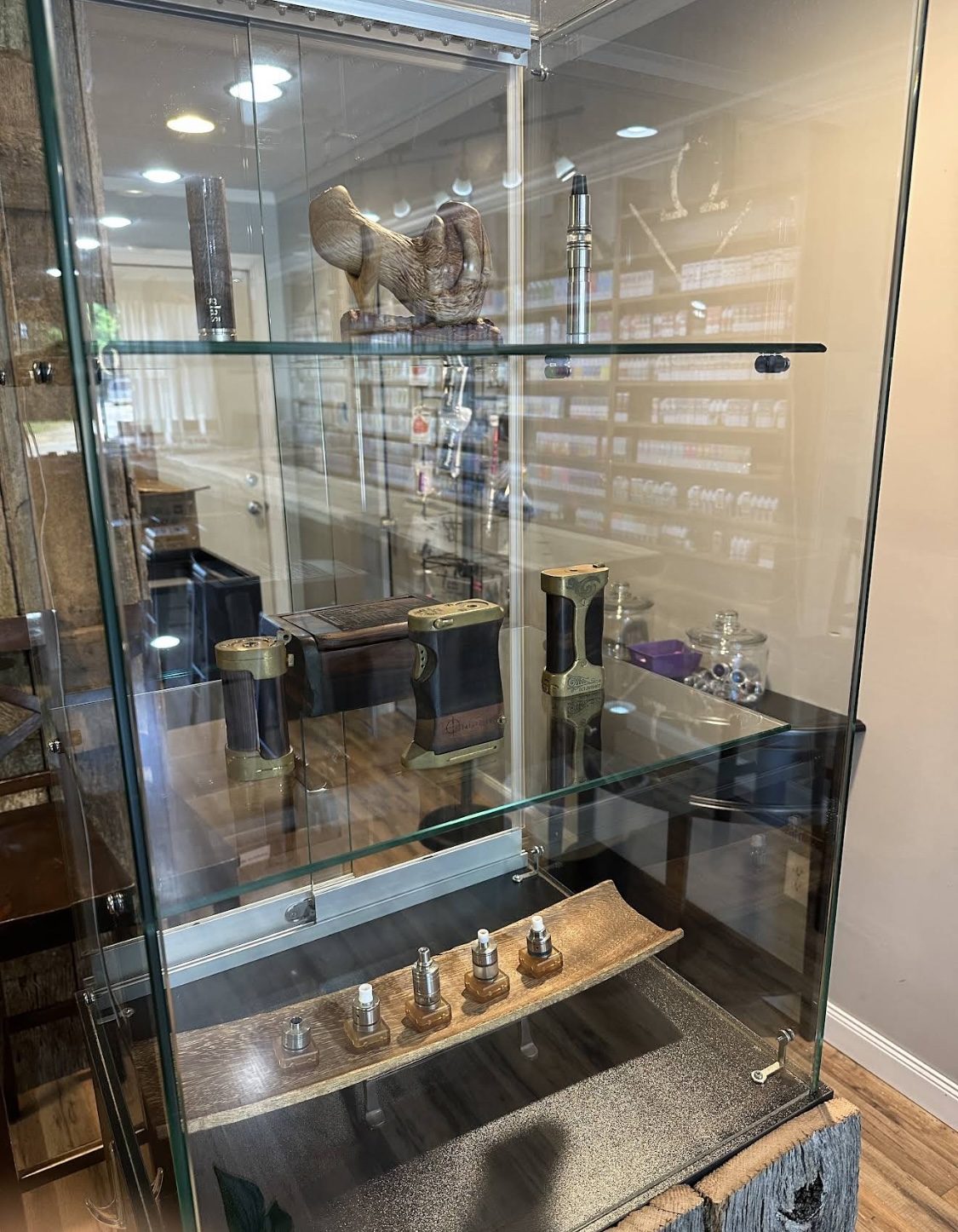 Collector wood and brass mods in a glass case